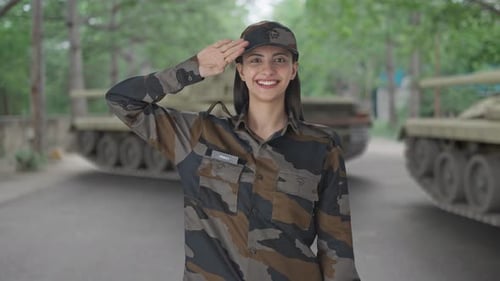 Woman in Military Uniform Smiling and Saluting