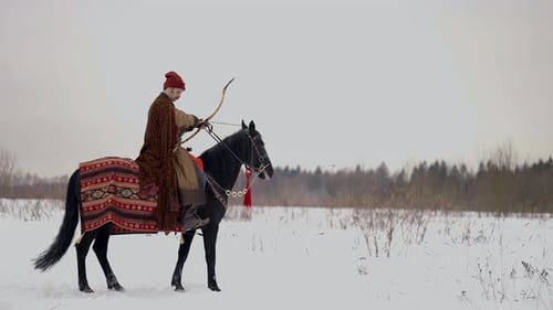 Archer Riding Black Horse in Winter Historical Reconstruction of 12 or 13 Century in Ruthenia