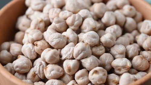 Wooden Bowl Full of White Chickpeas Close Up