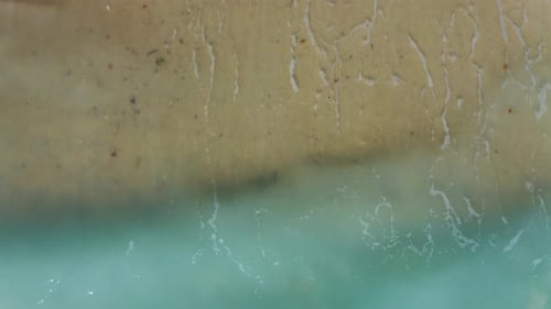 Aerial view of sand beach.Sea waves on the beautiful beach aerial view drone 4k shot. Beautiful turq