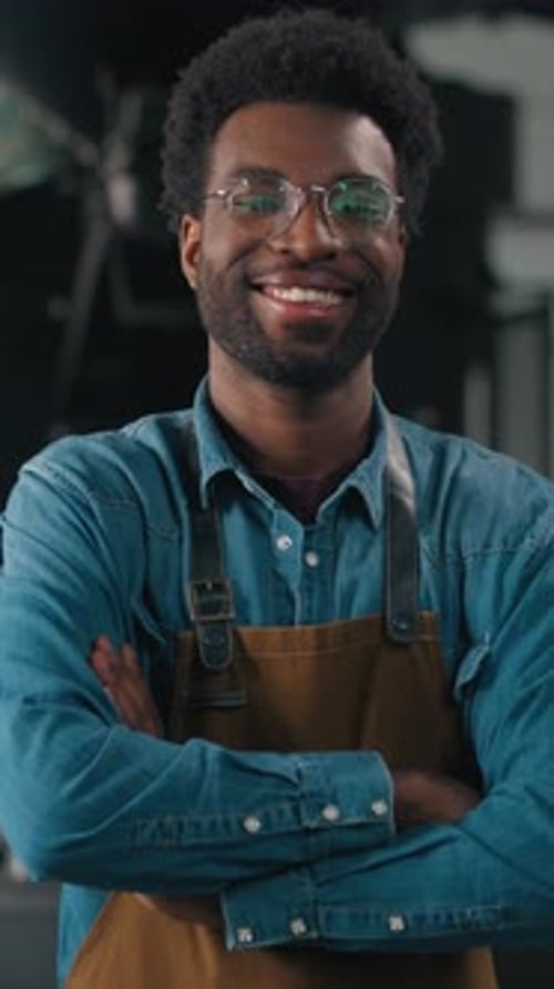 Smiling Young Man Posing With Arms Crossed