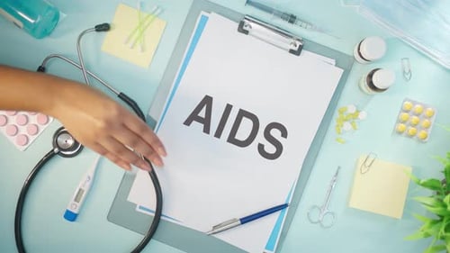 Medical Supplies Arranged Around AIDS Document on Table