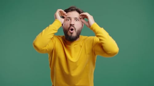 Surprised Bearded Man Making Mind Blown Gesture On Green Idea Eureka Moment
