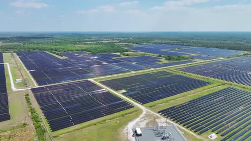 Aerial View of Large Sustainable Electrical Power Plant with Rows of Solar Photovoltaic Panels for
