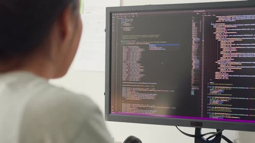 Close-up young Asia girl IT development programmer typing on keyboard coding programming.
