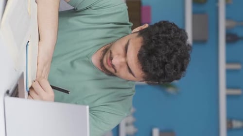 Young Man Works Remotely and Talks to Camera