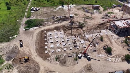 Aerial View of Construction Site with Heavy Equipment