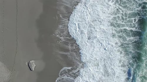 Aerial Video Towering Ocean Waves Create Stunning Foam Patterns During a Dramatic Coastal Storm