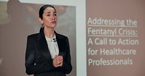 Woman, presenter and conference on healthcare, speaking and advice on drugs crisis