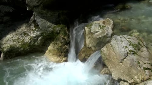 river rapids flowing in small waterfall, beautiful scene in Tolminka gorge in soca valley, slovenia