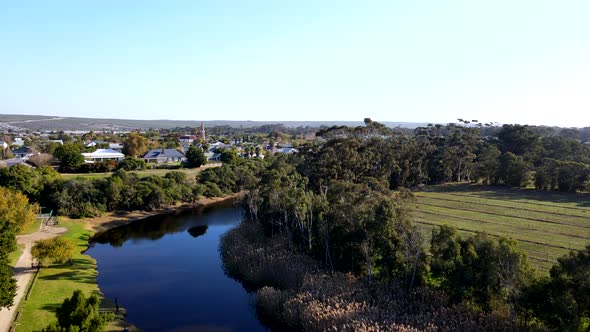 Drone riser from Klein River bank reveals countryside town Stanford in ...