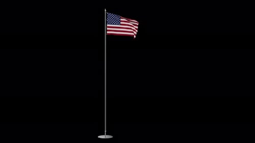 The flag of the United States of America is attached to a flagpole and slowly flutters in the wind a