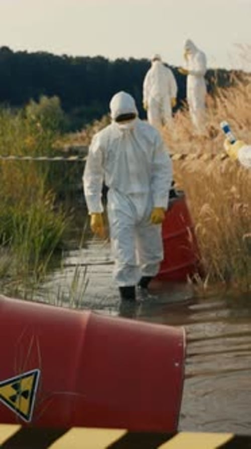 This Depicts a Complex Scene of Hazardous Waste Cleanup Involving Scientists in Protective Gear