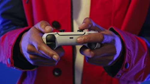 Hands Playing White Video Game Controller