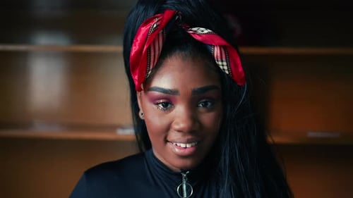 Smiling Young Woman Close-up with Red Bandana