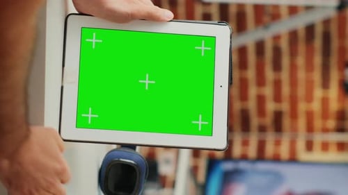 Hands Holding Tablet with Green Screen Close Up