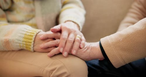 Senior Couple Holding Hands for Support