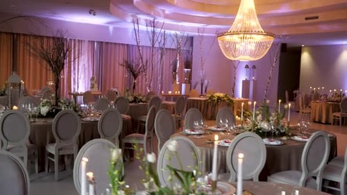 Elegant Wedding Reception Hall With Tables and Decorations