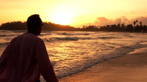 Silhouette of Man Walking on Beach Near Sea During Sunset, Super Slow