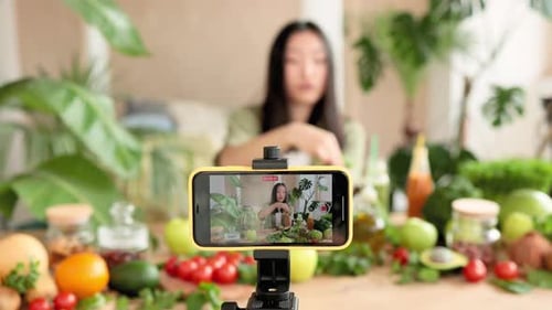 Woman Creates Food Vlog with Ripe Fruits