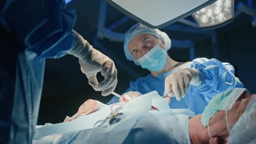 Two Surgeons Concentrated on Surgery