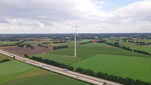Wind turbines next to highway