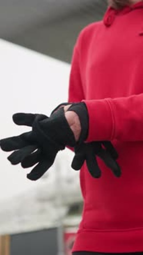 Woman Putting on Black Winter Gloves Warmth Cold Weather Snowy Hill Urban Structures