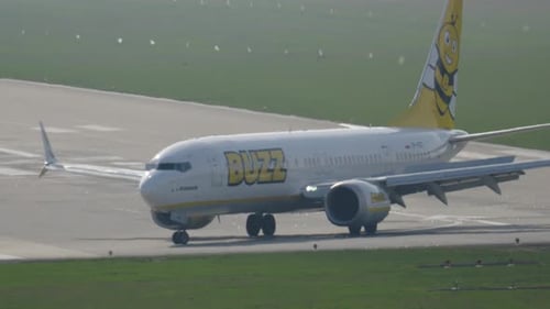 Airplanes taxiing on a sunny day at the bustling airport runway