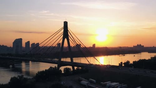Urban Cityscape with River Bridge with Moderate Car Traffic