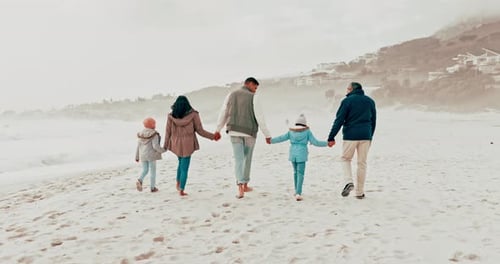 Beach, walk and back of family holding hands in nature with freedom, bond and vacation together