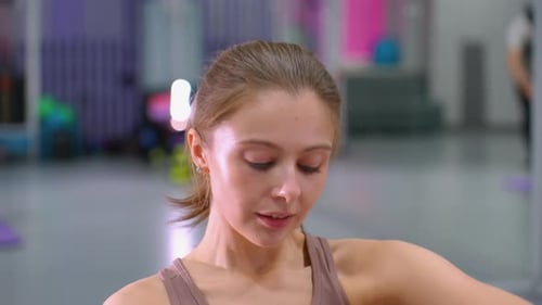 Close Up of Woman Engaged in Fitness Exercise with Mirror Reflection