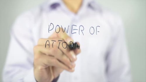 Hand Writes 'Power of Attorney' on Glass