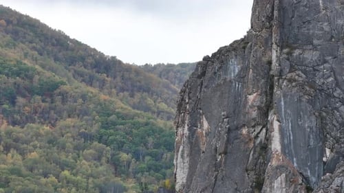 Aerial View of a Rocky Cliff in the Middle of the Forest