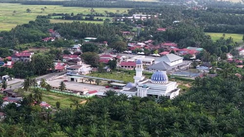 Aerial drone view of Masjid Jamek Sungai Acheh mosque and village