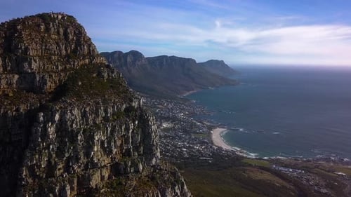Spectacular fly past Lions Head Mountani Peak to reveal The Twelve Apostles and Affluent Coastal Sub