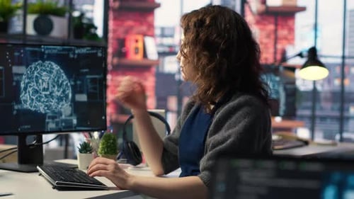 Woman Working on AI at Computer in Office