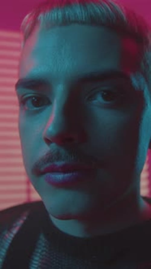 Confident Male Model in Vibrant Neon Setting Elegant Male Face with Retro Cinematic Mood and Bold