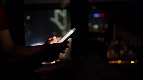 Closeup View of Male Hands Holding Smartphone and Surfing the Internet