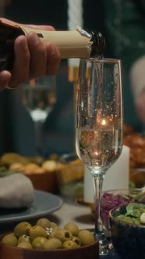 Elegant Champagne Pour at a Festive Gathering