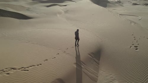 Man Walking on Desert in Africa