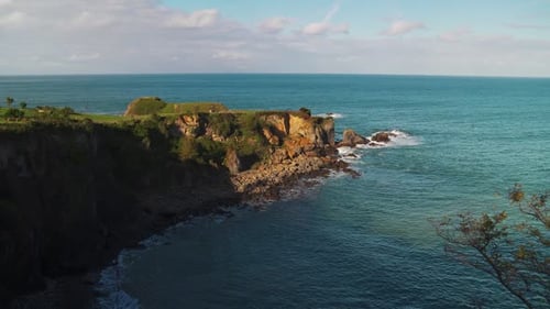Scenic View of a Rugged Coastline with Green Cliffs