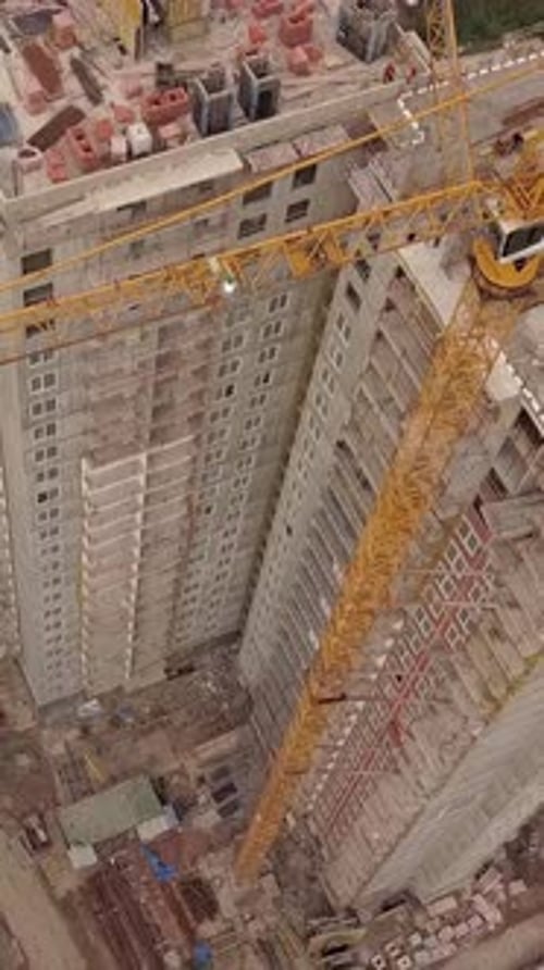 Vertical of Aerial Day Fly Over Under Construction New Modern Building Work Builders and Technicals