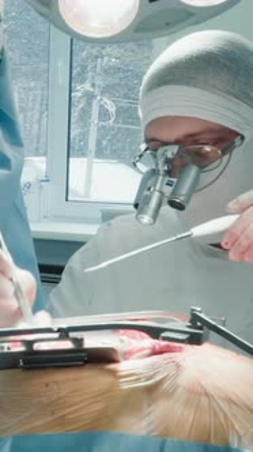 Doctor with Laser Scalpel Operates Heart in Clinic