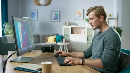 Professional Photographer Works in Photo Editing App / Software on His Personal Computer. Photo Edi