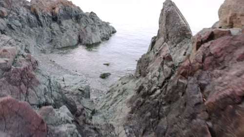 Rugged ocean beach rocks in drone point of view landscape scenery