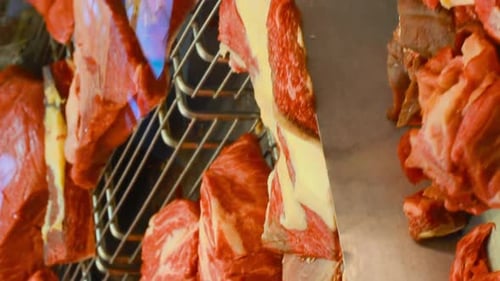 Vertical Footage Video Many Slices Of Red Meat On Display In Local Farmers Grocery Market