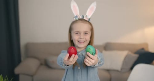 Happy Girl Holds Easter Eggs