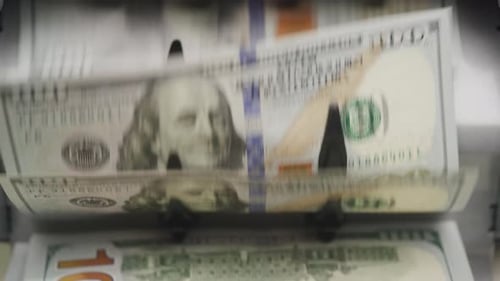 Closeup of Dollar Bills in Money Counter