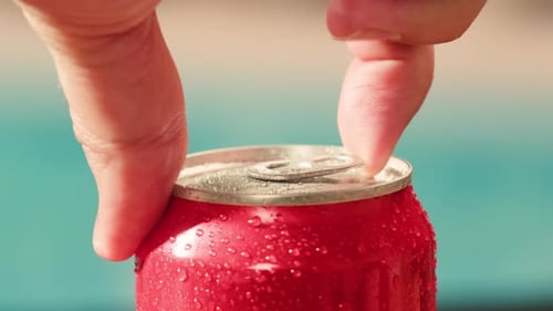 Opening Soda or Beer Can Macro Close Up of Can Pull Tab Opening Watering Refreshment Hand Open