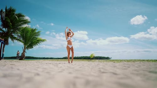 Sexy Lady in Bikini Relaxing on Empty Beach on Island in Ocean Happy Vacation Beautiful Woman